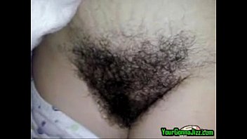 Hairy Latina babe shows off and teases her unshaved pussy